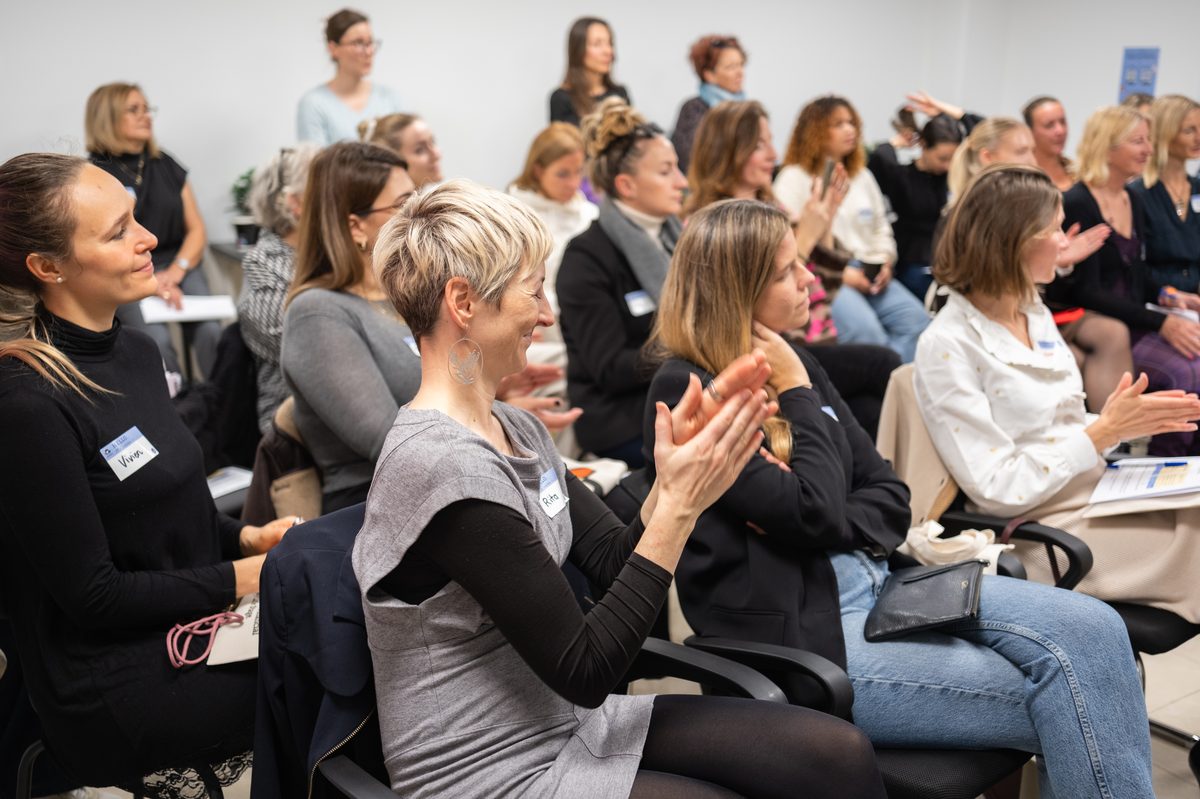 The room applauding at the launch event