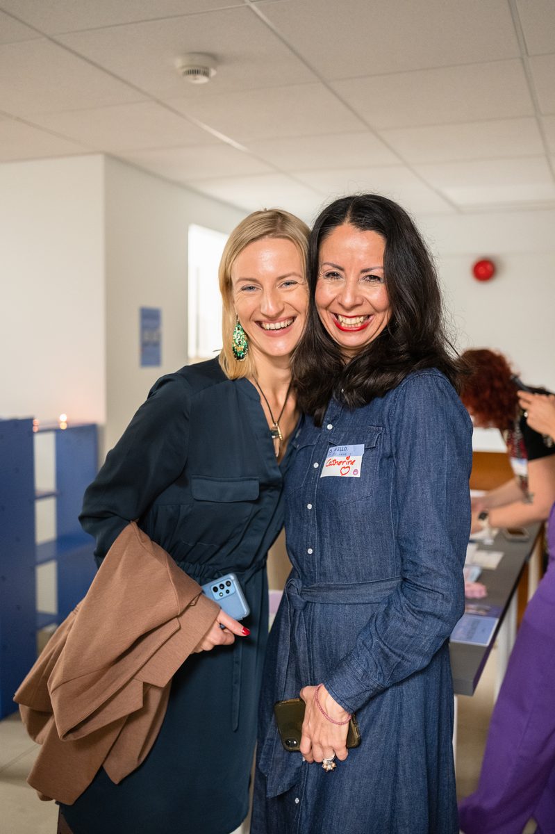 Two women embracing at the launch event
