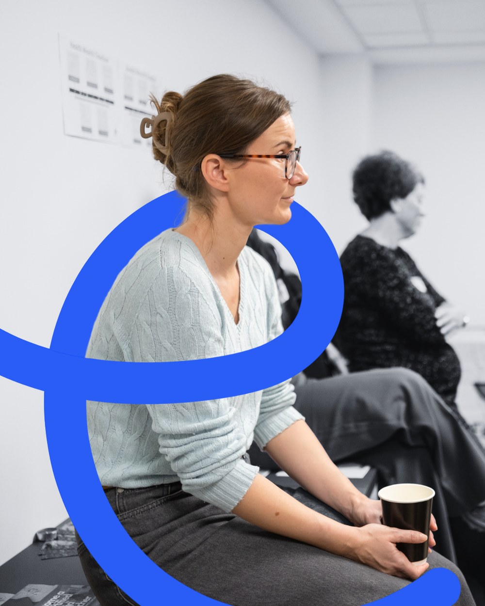 A woman listening closely at a FemNEST event